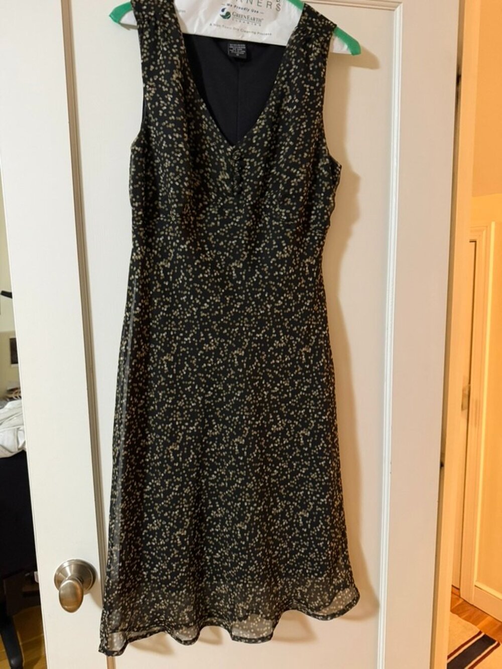 Sleeveless dress, black with gold and white dots, size 8